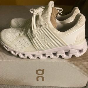 Woman’s all white Cloudswifts On running athletic shoes